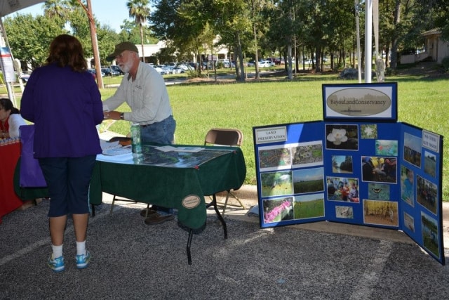 Bayou Land Conservancy booth with land preservation display panels at CreekFest Houston