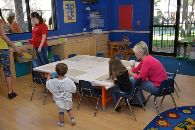 Children doing art activities at CreekFest Houston