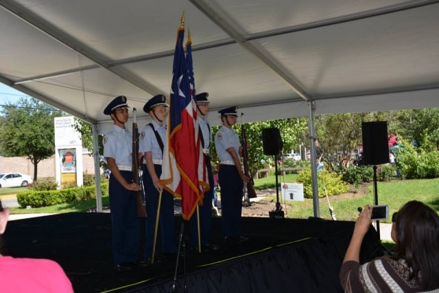 ROTC color guard presenting flags on the CreekFest main stage