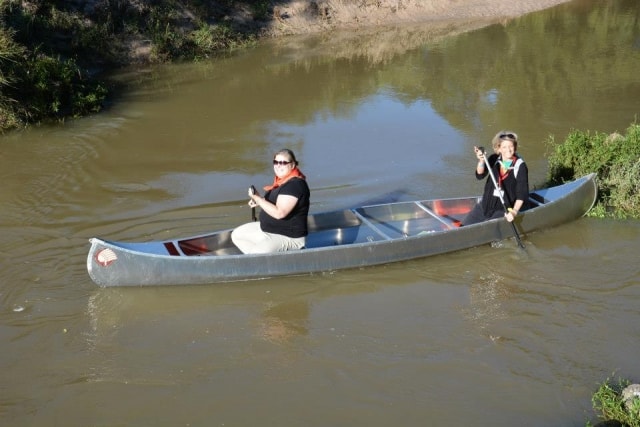 Two people canoeing on Cypress Creek at CreekFest