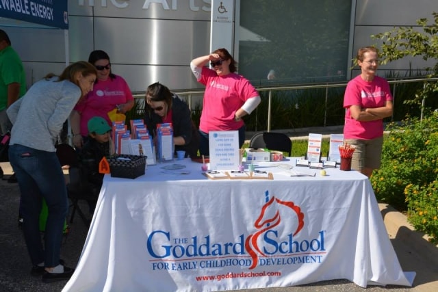 The Goddard School booth with volunteers at CreekFest Houston