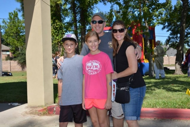 Family of four posing together at CreekFest Houston
