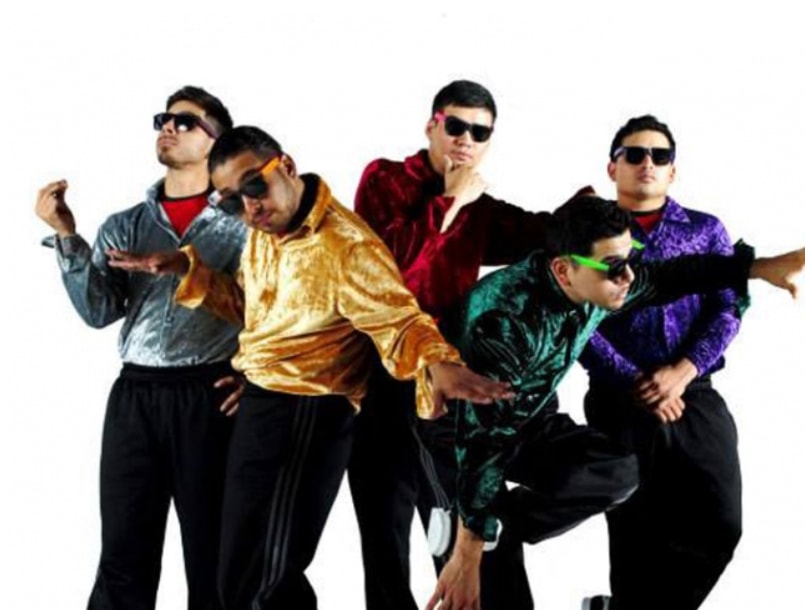 Breakdance crew in colorful velvet jackets posing with sunglasses
