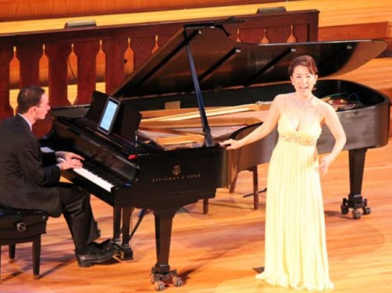 Soprano and pianist performing on stage at The Centrum