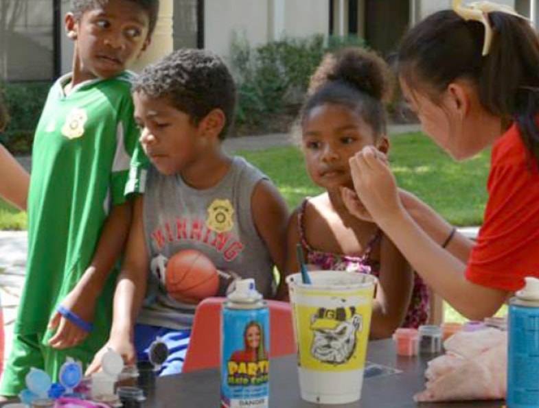 Children face painting project at CreekFest